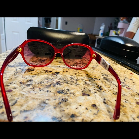 Used Coach burgundy color sunglasses in good condition. - Picture 4 of 6